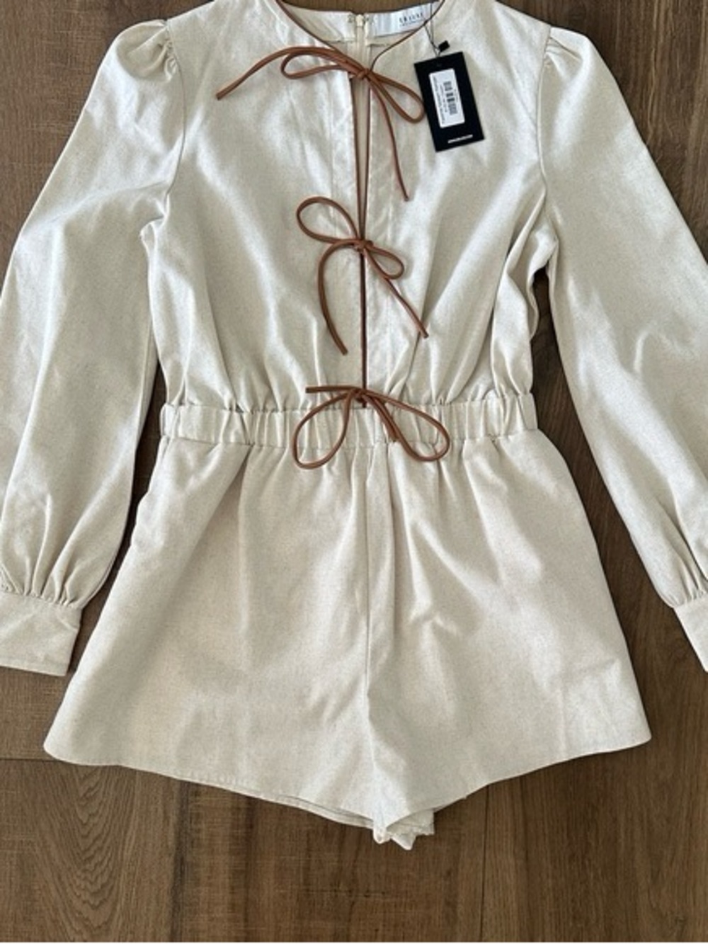Cream Long-Sleeve Romper with Brown Tie Accents